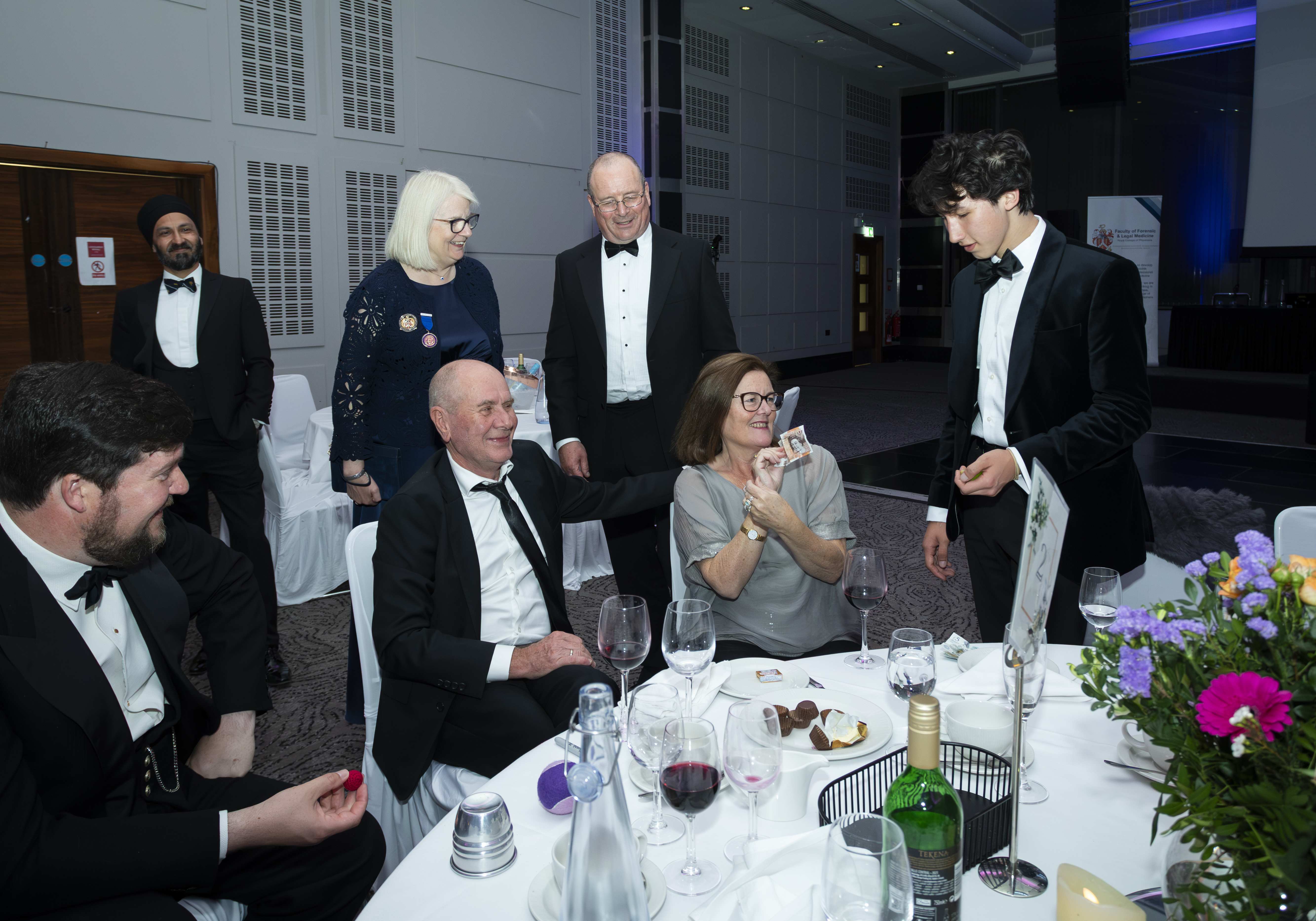 Noah entertaining guests with close-up magic